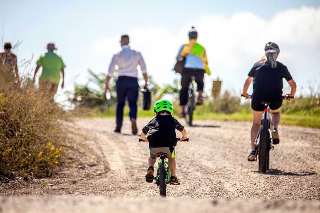 Cildrena and adults doing Biking
