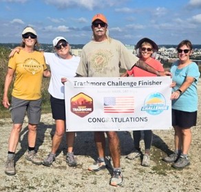 Photo of John holding finisher Sign.jpg